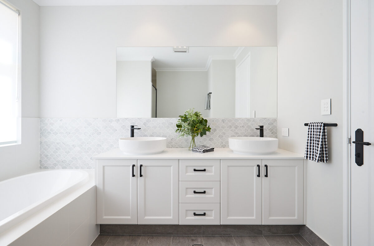 Carriage Cottage Bathroom with double sink and white vanity