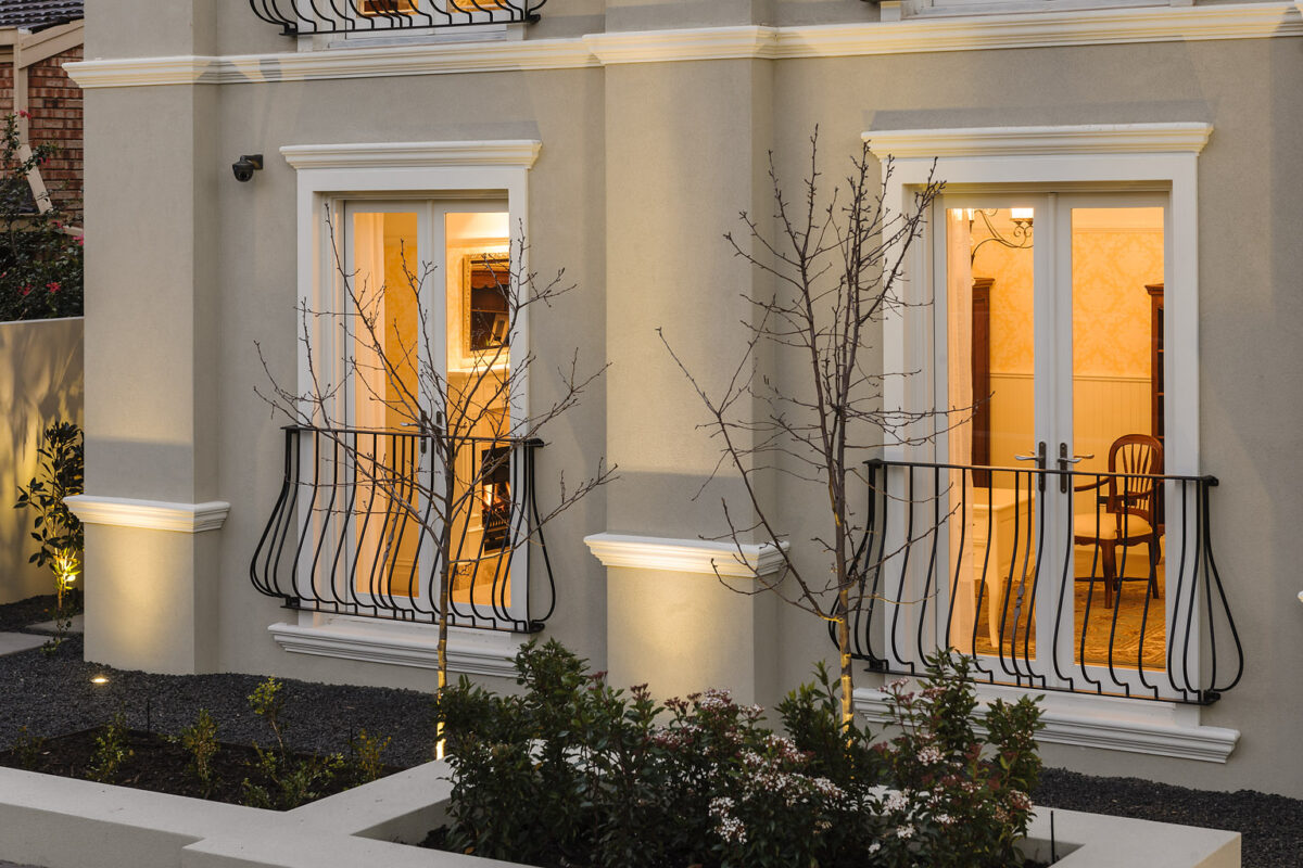 French provincial exterior of the Bellevue home design featuring curved balustrades