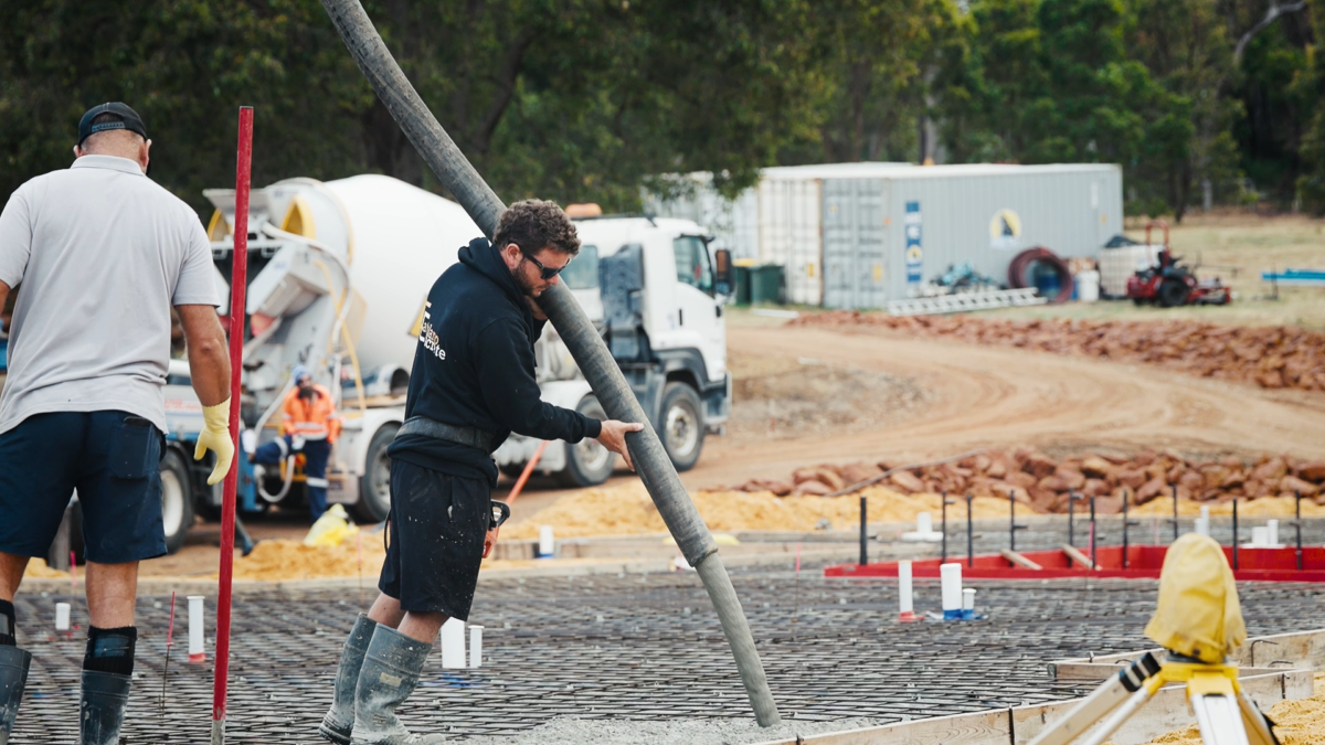 Pouring concrete during the slab pour - The Arabesque Client Journey with Oswald Homes